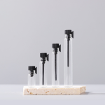 Clear glass sample vials with black caps and dropper applicators, size lineup