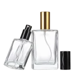 Clear glass spray bottles with gold and black sprayers